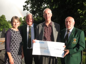 Presentation of a cheque to Lisburn Outlook by Edenmore Golf Club